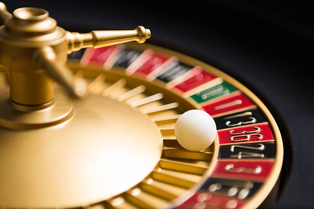 Player making a decision at Caribbean Stud Poker table